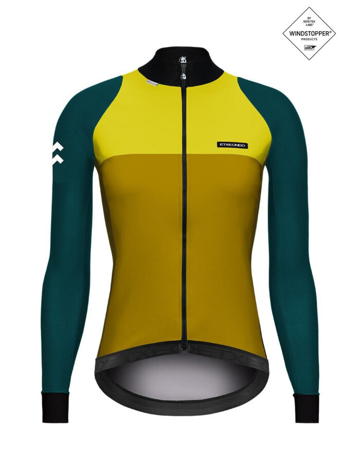 76-fem-ama-1 ETXEONDO Chaqueta Mujer 76 Gore-Tex Windstopper amarillo mostaza - Imagen 1